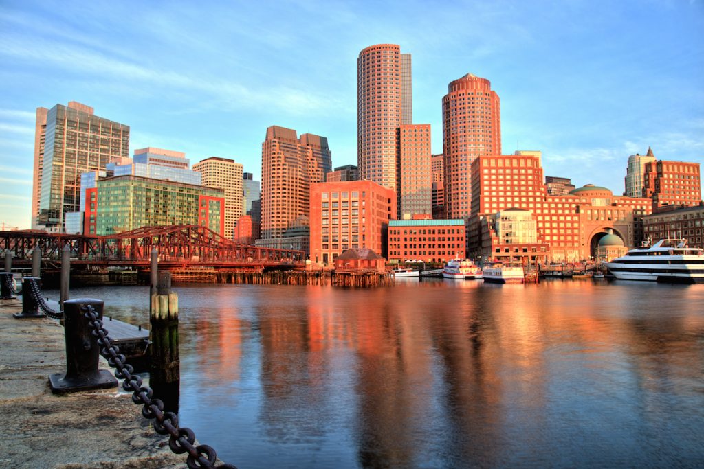 Boston Skyline With Financial District And Boston Harbor At Sunrise