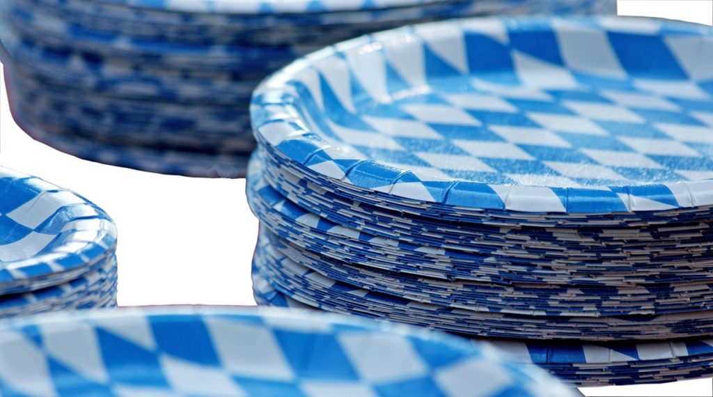 stacks of blue and white paper plates on a white background