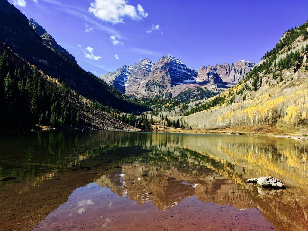 clear water view with mountains in the background in Aspen, Colorado