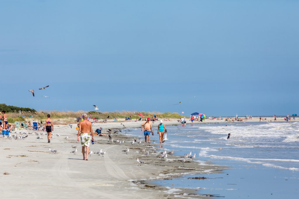 People walking on the beach at St Simons Island. 